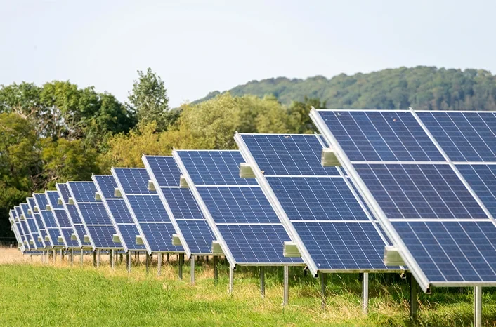 Ground mounted solar panels in a field